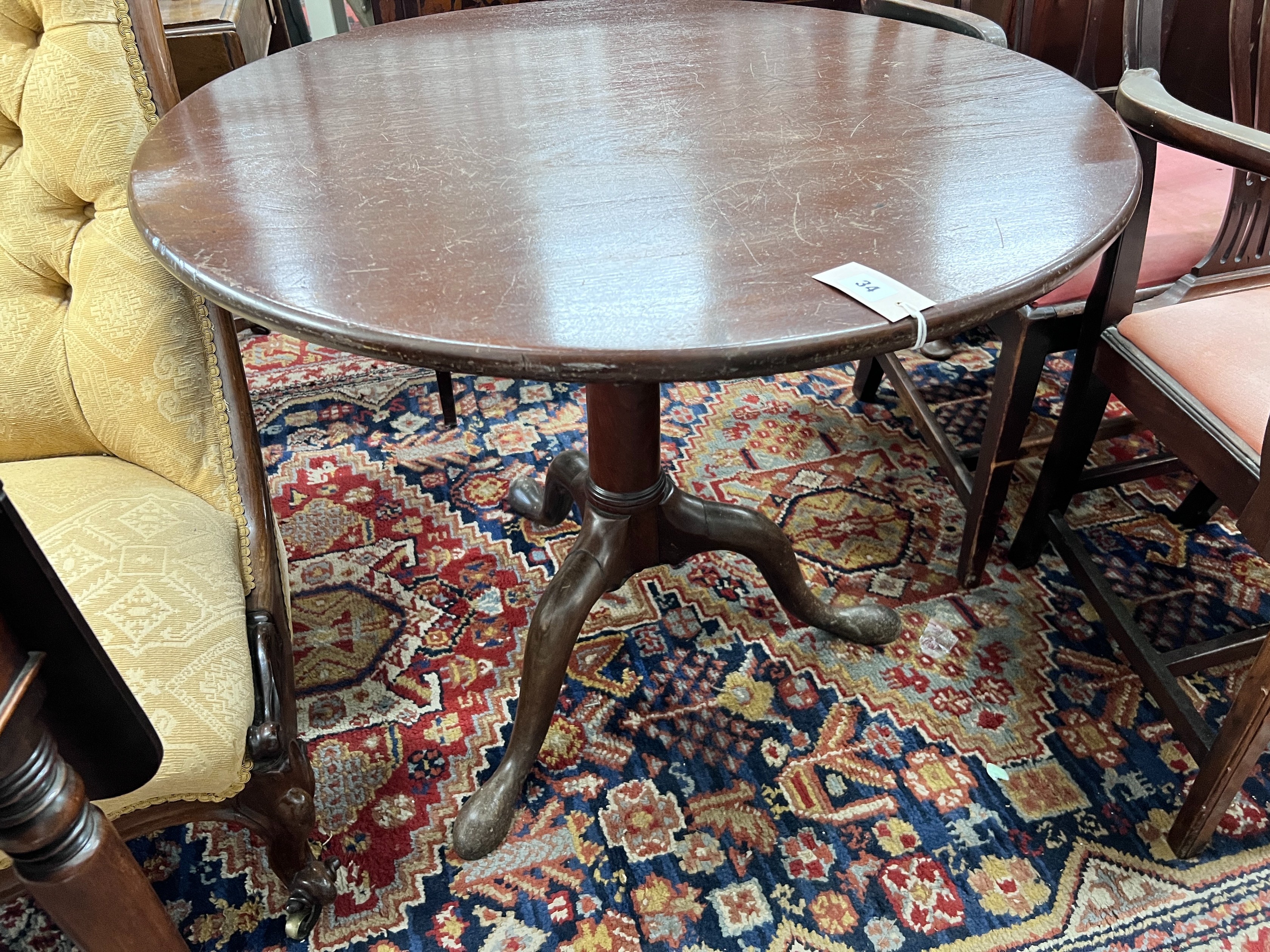 A George III circular mahogany tilt top tripod tea table, diameter 84cm, height 70cm *Please note the sale commences at 9am.